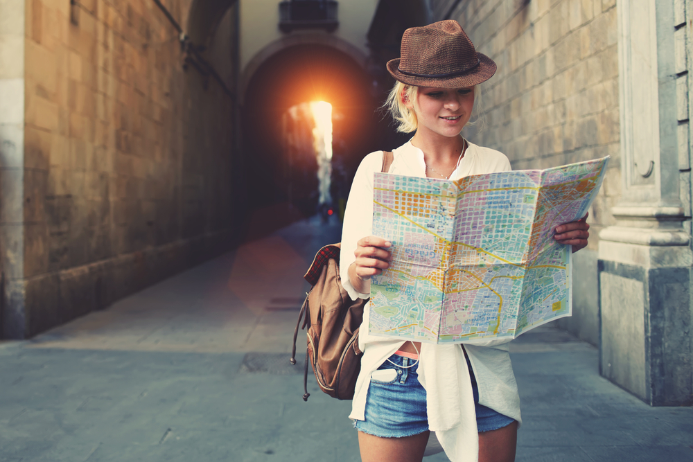 woman with a travel map going abroad